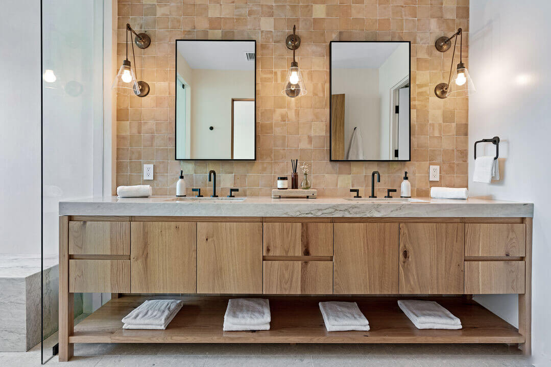 Master bathroom with custom vanity of wood and marble