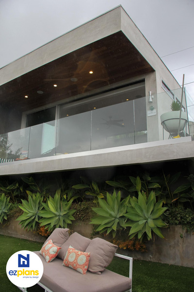 Modern-style, hillside ADU above foliage